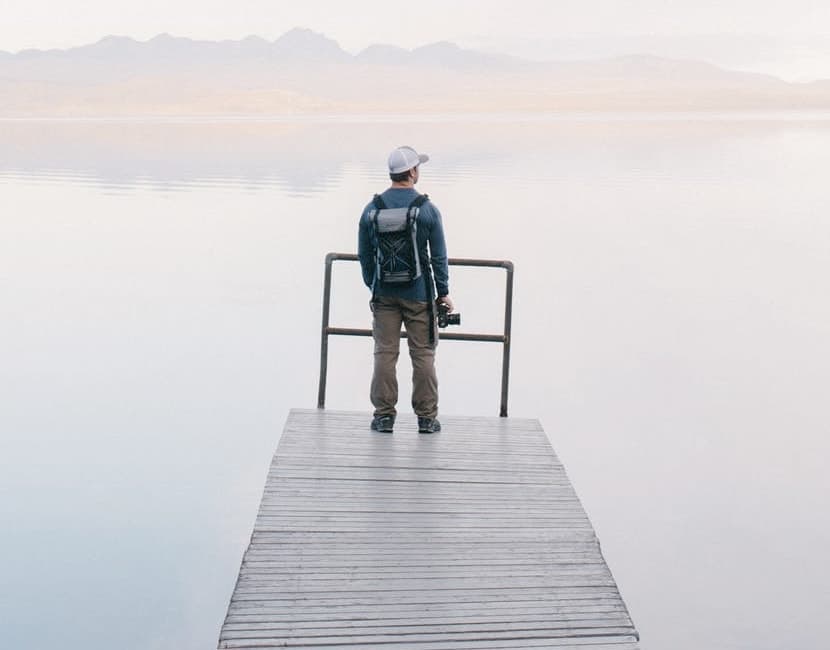 man standing by lake